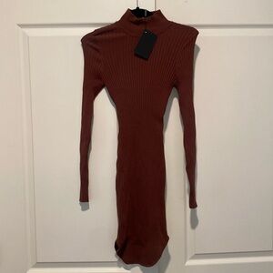 Sweater dress with short turtle neck. Can be worn over tights- stretchable.